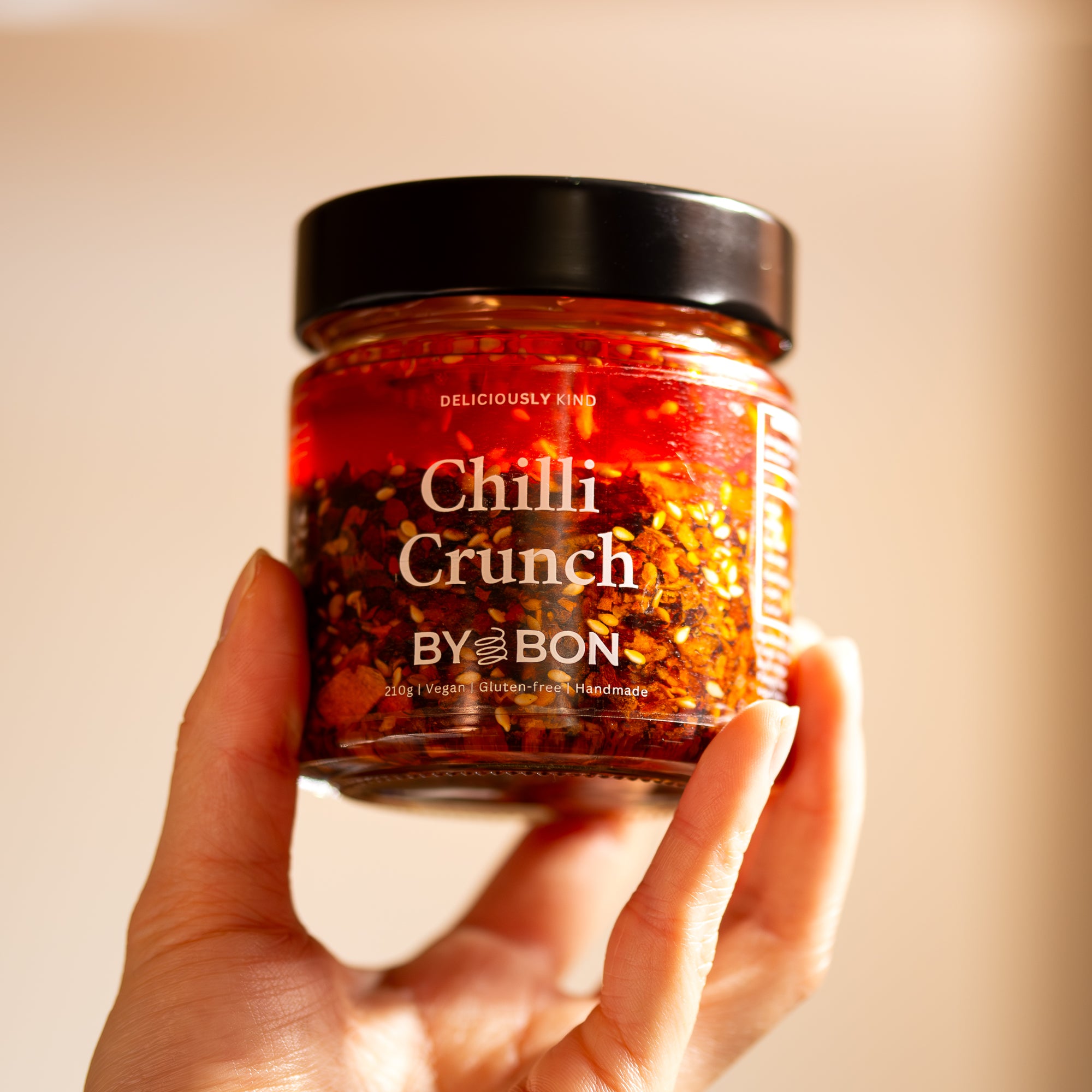 Chilli Crunch held in hand Chilli Oil Vegan